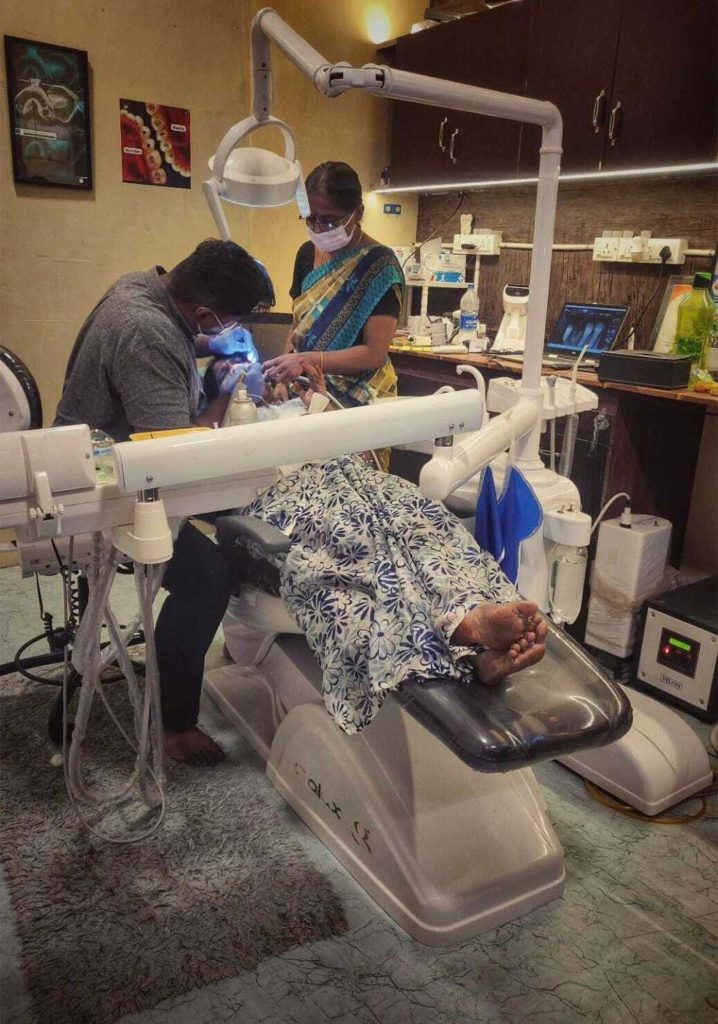 Dental chair and equipment with plant in background